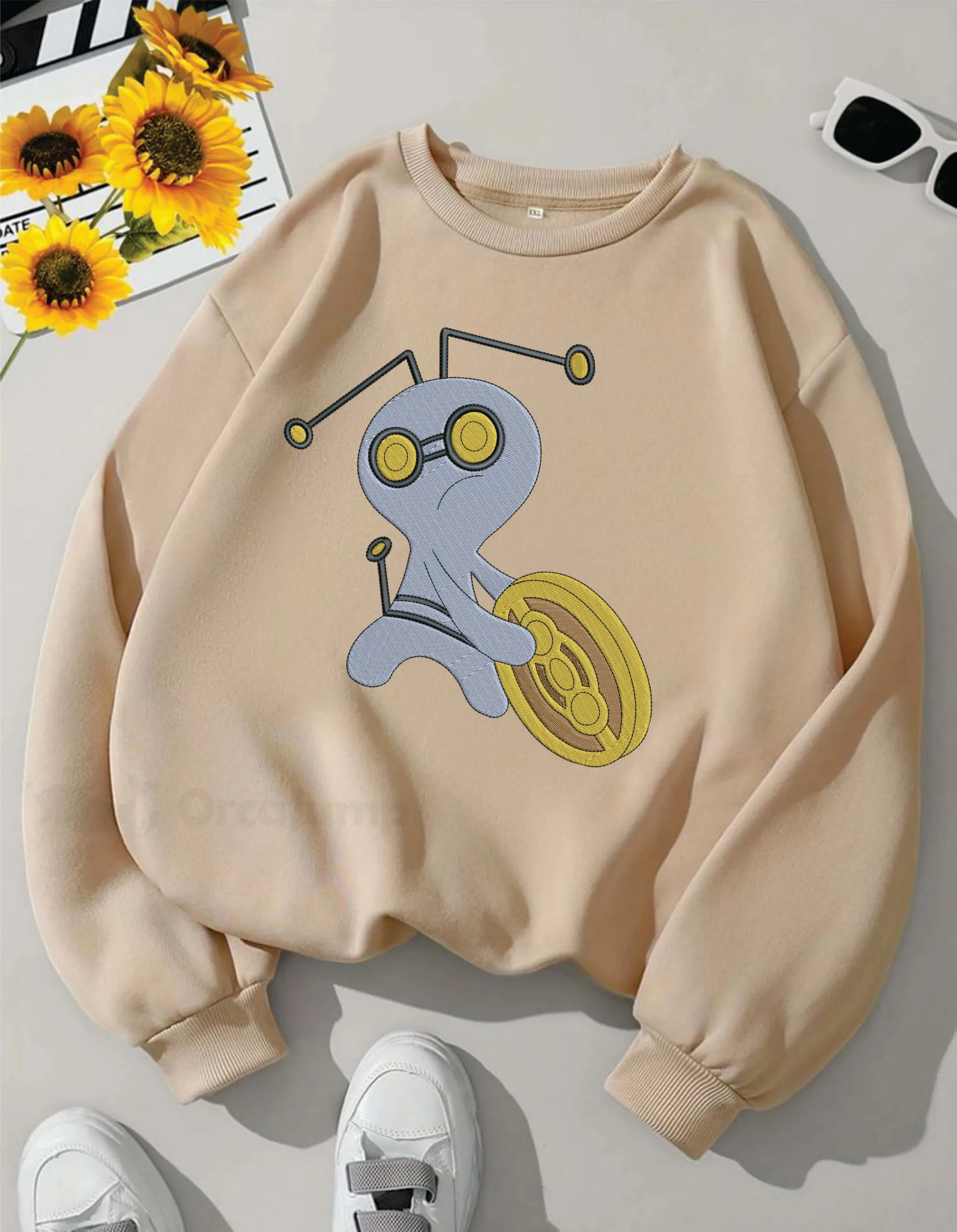 Gimmighoul pokemon embroidery design from widoembroidery.com